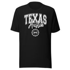 oducing the "Austin Texas United States Of America 1845" t-shirt by Kooskadoo – a stylish homage to the Lone Star State and the vibrant city of Austin! Crafted from premium Bella-Canvas fabric, this unisex tee combines comfort and quality, ensuring you'll look and feel great no matter where your adventures take you. With its sleek design and timeless appeal, it's the perfect addition to any wardrobe. Celebrate the rich history and unique culture of Austin, Texas, with this eye-catching t-shirt. Fan Merchandise Relaxed Fit T-shirt With Lettering, Graphic Tee With Lettering For Fans, Black T-shirt With Lettering For Fans, Graphic Tee With Lettering For Fan Merchandise, Fan Merchandise Graphic Tee With Lettering, Black T-shirt With Lettering For Fan Merchandise, Black Fan Apparel T-shirt With Lettering, Fan Merchandise T-shirt With Lettering And Short Sleeves, College Fan Apparel T-shirt With Lettering