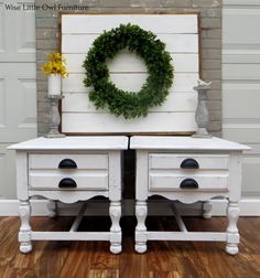 two white dressers with a wreath on the top and bottom, both side by side