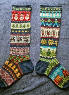 a pair of knitted socks sitting on top of a blue blanket next to pictures of christmas sweaters