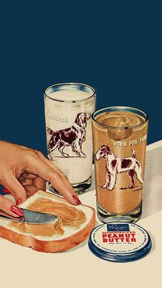 a woman cutting bread with a knife and two glasses on the table next to it