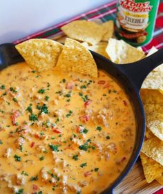 a skillet filled with tortilla chips and salsa