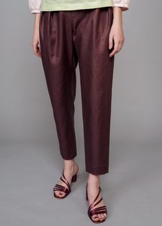 Introduce both a new color and texture to your wardrobe with the IRA LYSA Merlot Linen Pants. Reach for these Chocolate or Burgundy color linen pants when completing your next sleek look. Tired of wearing black all the time? Spice it up with an earth tone and a high-waisted easy silhouette. Go from the office to an evening stroll with ease in these pants. The styling options are endless and the color flattering. * Pegged pants* High rise with belt and loops* Pockets* Deep pleats on the front* Cr Brown Linen Long Pants, Solid Linen Pants For Fall, Plain Linen Pants For Fall, Fall Linen Ankle-length Harem Pants, Brown Linen Straight Leg Bottoms, Brown Linen Workwear Bottoms, Brown Linen Bottoms For Work, Brown Linen Pants For Work, Brown Linen Tapered Leg Bottoms