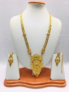 Handmade Indian Jewelry Asian Wedding Bridal Jewellery Party Ethnic Wear 22ct Gold Plated Bridal Necklace Set Rani Haar Bridal Jewellery Set  PLEASE NOTE, This Item Is Not Real Gold .Only Good Quality Gold Plated Jewellery .it is Artificial jewellery. It is a perfect match with formal attire on special occasions or with casual wearing.  Slight Colour variations possible due to difference in screen and photograph Care instructions Keep Jewellery away from direct heat, water, perfumes, deodorants Traditional 22k Gold Jewelry Sets For Puja, Traditional 22k Gold Bridal Necklace For Puja, Traditional Gold Plated Bridal Necklace For Puja, Festive Gold Bridal Sets With Zari Work, Gold Traditional Wear For Festivals And Ceremonies, Gold Plated Bridal Necklace For Puja, Gold Temple Necklace With Tilla For Eid, Heavy Gold Bridal Necklace For Puja, Gold Jewelry Sets With Zari Work For Ceremonies