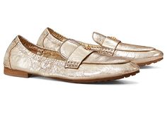 Tory Burch Ballet Loafer - Women's Shoes : Spark Gold : Enjoy the comfort of ballet footwear with the appealing looks of loafers wearing the Tory Burch Ballet Loafers. Suede upper. Sheep leather lining. Cushioned insole. Brushed gold double T detail. Hand-painted edges and stitches. Ruched sides offer easy movement. Almond toe. Slip-on style. Leather and rubber outsole. Imported. Gold Formal Loafers With Branded Insole, Luxury Gold Flats For Spring, Designer Gold Loafers For Work, Classic Gold Flats With Flat Heel, Gold Loafers For Spring Formal Occasion, Luxury Gold Flats, Elegant Gold Flats For Work, Elegant Gold Flat Loafers, Classic Gold Slip-on Loafers