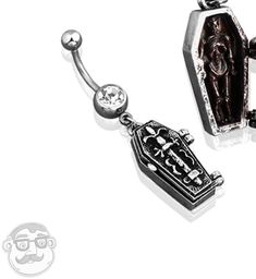 two black and white items are attached to silver hooks, one with a diamond in the middle