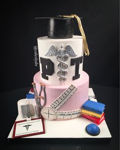 a cake with a graduation hat and medical equipment on it