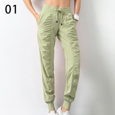 Look stylish and stay comfortable with these Women's Drawstring Workout Pants with Pockets. Crafted from a polyester blended material, these pants feature a pleated design, medium stretch, and a loose fit for maximum comfort. Choose from 7 different colors to find the perfect fit for you. These pants are perfect for any season and any occasion. With a high waist and straight pant style, you'll look great and feel great. The drawstring and pockets add a stylish touch to the pants, making them per Stretch Harem Pants With Elastic Waistband For Leisure, Stretch Solid Color Harem Pants For Leisure, Stretch Pants With Drawstring For Leisure, Solid Stretch Harem Pants For Leisure, Stretch Harem Pants For Leisure, Solid Ankle-length Drawstring Harem Pants, Solid Ankle-length Harem Pants With Drawstring, Solid Color Long Pants Activewear With Drawstring, Nylon Leisure Bottoms With Elastic Waistband