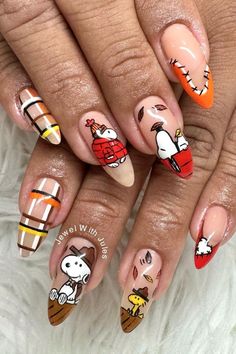 Get inspired with these fun and festive Thanksgiving nail designs! From pumpkins and plaid to cute turkeys and fall icons, these creative manicure ideas are perfect for celebrating the holiday season in style. Thanksgiving Nail Art, Thanksgiving Nail Designs, Thanksgiving Nail Ideas, Thanksgiving Nails, Thanksgivings Nails, Thanksgiving Nail Peanuts Thanksgiving Nails, Snoopy Nails Thanksgiving, Snoopy Nails Design, Snoopy Fall Nails, Snoopy Fall, Plaid Nail Designs, Turkey Nails, Thanksgiving Nail Designs