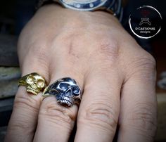 ** Handmade skull ring in solid Sterling silver Contemporary style representation of a human skull with a glossy mirror finish handmade or with grated and nuanced textures to mark volumes. With a strong and solid ring bridge to last a lifetime. ** APPROXIMATE MEASURES (they are always approximate since this ring is handmade and each one we make is unique) CRANEO: 15.40m wide / 17.2 high RING BRIDGE: 6.5mm wide / 2mm thick APPROXIMATE WEIGHT: 12.5 gr. ** For people who want to wear a skull ring b Skull Ring With Polished Finish As Gift, Gift Skull Ring With Polished Finish, Memento Mori Ring, Vampire Skull, Skull Planter, Sterling Silver Skull Rings, Skull Engagement Ring, Handmade Skulls, Handmade Mirror