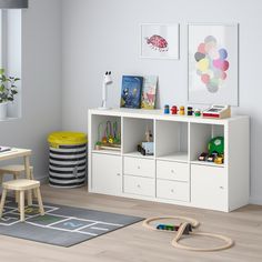 a child's playroom with toys and bookshelves