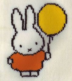 a white shirt with an image of a bunny holding a yellow balloon