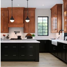 a kitchen with wooden cabinets and white counter tops is pictured in this image, there are three hanging lights above the sink