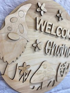 a wooden sign that says welcome to another country