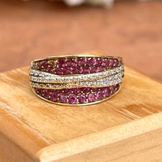 Estate/ vintage 14KT yellow gold pave, fancy pink sapphires + diamonds concave band ring. Statement-getting piece with fabulous pink sapphires. 2 carat total weight gemstones Size 9.25 Can be resized for an additional fee Band width: 10mm Tapered back Faceted pink sapphires + diamonds Open gallery inside Prongs have been checked and they do not catch fabric whatsoever Weight: 2.7 grams Stamped 14K Excellent estate condition Saint Jewelry, Open Gallery, 2 Carat, Sapphire Diamond, Pink Sapphire, Band Ring, Band Rings, Sapphire, Bangles