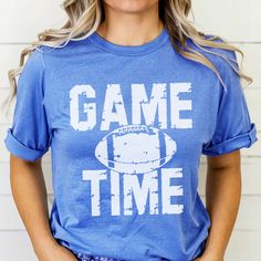 Are you ready for some football!? Get game day ready with this adorable vintage football tee! These relaxed fit tees pair perfectly with jeans and sneakers or booties! Size Guide: we recommend your true size for a loose fit or size down for a fitted fit. Tees are Unisex. Heather blend shirts are 52/48 Cotton/ Poly Blend and Solid Shirts are 100% Cotton. Shirts are Unisex. Casual Blue T-shirt For Football Season, Sporty T-shirt For Game Day Football Season, Sporty T-shirt For Football Season Game Day, Sporty T-shirt For Game Day During Football Season, Team Spirit Game Day T-shirt For Fall, Team Spirit T-shirt For Game Day In Fall, Casual Text Print Tops For Football Season, Game Day Team Spirit T-shirt With Relaxed Fit, Graphic Tee T-shirt For Game Day, Soft-washed