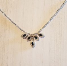 This vintage necklace has black and clear rhinestones.  It is simple and delicate for just a touch of elegance for any occasion. Elegant Black Rhinestone Necklace For Wedding, Black Rhinestone Necklace For Formal Occasions, Black Rhinestone Necklaces For Formal Occasions, Evening Crystal Necklaces With Sparkling Stones, Elegant Black Rhinestone Necklace For Formal Occasions, Elegant Black Rhinestone Necklace For Formal Events, Black Cubic Zirconia Necklace For Party, Evening Rhinestone Necklace With Diamond Accents, Black Rhinestone Necklace For Wedding