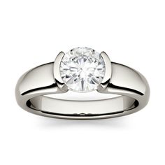 Modern and sleek. This engagement ring boasts a round Forever One solitaire in a semi-bezel setting. A total showstopper. We can't even. Available in white gold with a total weight of 1. 20ctw in GHI size 7. . Features Charles & Colvard premium brand of moissanite: Forever One Near-Colorless (GHI range) These gems are internally flawless to very slightly included (IF-VS). The color, or lack thereof, of these gems is impeccable, as is each cut mastered to showcase the optimum brilliance and fire Half Bezel Ring, Half Bezel Engagement Ring, Round Solitaire Rings, Half Bezel Setting, Half Bezel, Bezel Engagement Ring, Helzberg Diamonds, Bezel Set Ring, Bezel Ring