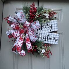 a christmas wreath hanging on the front door