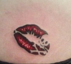 a woman's stomach with red lips and bones on the bottom part of her stomach