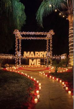 the entrance to marry me is lit up with candles