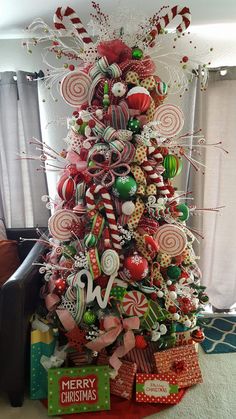 a christmas tree decorated with candy canes and candies