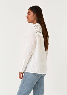 An ultra-pretty bohemian blouse with long sleeves and a sheer eyelet lace yoke detail. Cotton eyelet lace yoke Relaxed fit Long sleeve Button cuff closure Ruffled round neckline Self-covered button front Bohemian spring blouse A sheer eyelet lace yoke detail adds a feminine touch to this timeless bohemian blouse. With long sleeves, a self-covered button front, and a ruffle-trimmed round neckline. Perfect for the office or the weekend, this versatile style pairs well with denim. Model is 5'9, wea White Boho Blouse, Spring Blouse, Blouse With Long Sleeves, Bohemian Blouse, Spring Blouses, White Lace Blouse, Bohemian Blouses, Bohemian Tops, Boho Blouse