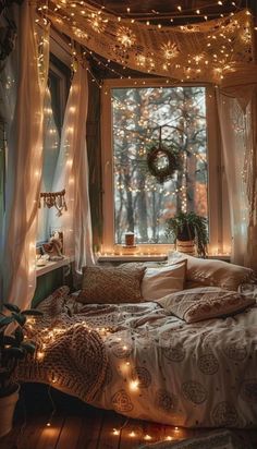 a bedroom with lights strung from the ceiling and curtains on the window sill over the bed