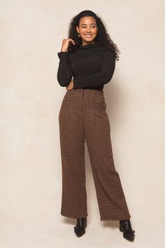 Get ready to strut your stuff in our Tabitha Trousers! Made from a chic houndstooth woven fabric in brown, black, and rust, these ankle length slacks are the perfect addition to any fall wardrobe. With convenient pockets, a secure hook and bar closure, and full lining, these non-stretch slacks offer both style and functionality. Time to step up your fashion game! Brown Office Pants For Fall, Chic Brown Pants For Fall, Winter Office Brown Bottoms, Fall Houndstooth Trousers, Brown Pants For Workwear In Fall, Brown Straight Pants For Fall, Fall Houndstooth Straight Pants, Fall Houndstooth Pattern Straight Bottoms, Fitted Houndstooth Pants For Fall