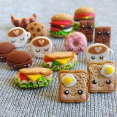 there are many miniature sandwiches and donuts on the floor