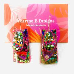 Handcrafted Canvas Earrings.  Hand Painted in Original Design.  Lightweight. Silver Hoops. Plastic Protective Cover.  Free Postage Plastic Bottle Earrings, Multicolor Rectangular Earrings For Party, Colorful Party Earrings With Ear Wire, Artsy Multicolor Rectangular Earrings, Artsy Multicolor Earrings For Party, Green Artsy Earrings For Party, Artsy Green Earrings For Party, Funky Multicolor Earrings For Parties, Bottle Earrings