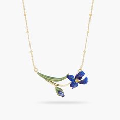 Inspired by the many facets of the iris flower, this necklace features a stem decorated with faceted glass and a majestic and mystical flower. Perfectly resting on the curve of your neck, this designer jewel will be your ally for a harmonious silhouette. Thin Necklace: Gilded and hand-enameled brass, faceted glass. Length:40 Extension:5 Width:3,6 Depth:0,8 Weight:5,6 AMSO210/1 AMSO210/1 Siberian Iris, Iris Ring, Fine Necklace, Les Nereides, Glass Bangles, Hand Painted Earrings, Iris Flower, Asymmetrical Earrings, Painted Earrings