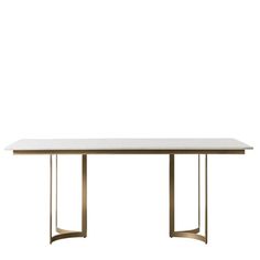 a white table with gold legs and a marble top