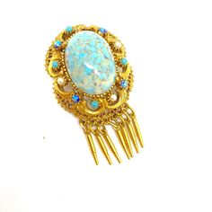 Classic Ornate Blue Marbled Gold Florenza Drop Dangle Brooch - Signed This beautiful brooch is a vintage one from the 1970's  Florenza's jewellery collection It is defined by the delicate setting and elegant design  and uses the best stones available Everything about this brooch makes it a great example of Florenza jewellery  The setting has some lovely gold scroll work  It has a large marbled Blue cabochon as its central feature  surrounded  by a frame of Faux Pearls ,Blue Aurora Borealis and F Vintage Blue Brooch Pin, Vintage Blue Jewelry Brooch, Vintage Blue Brooch, Blue Aurora, Blue Aurora Borealis, French Rose, Carved Shell, Metal Bracelets, Aurora Borealis