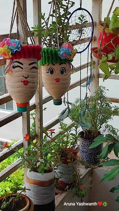 several plant pots with plants hanging from them on a porch or balcony, decorated with flowers and tennis rackets