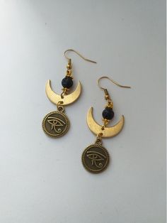 Egyptian Eye of Horus Earrings 🌿 . This pair is made of brass hypoallergenic parts. No Nickel No Lead . . The item will arrive at you wrapped as a gift in a paper gift bag. . Here are some tips to ensure longevity with my pieces: 》 Avoid showering, swimming, and exercising with my pieces. 》 Avoid wearing perfumes with your jewelry. 》 Avoid sleeping with your pieces on. 》 When not in use, store items in a box. . 》SHIPPING: If you need a tracking number for your order change the shipping option b Symbolic Metal Jewelry With Matching Earrings, Handmade Symbolic Earrings, Symbolic Teardrop Jewelry With Matching Earrings, Symbolic Handmade Dangle Jewelry, Symbolic Handmade Round Earrings, Handmade Symbolic Drop Earrings, Bronze Earrings With Natural Stones As Gift, Adjustable Nickel Free Spiritual Plug Earrings, Bronze Earrings With Natural Stones For Gift