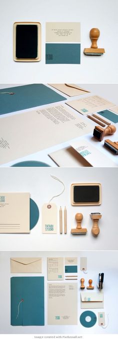 various stationery items are arranged on top of each other, including envelopes and business cards