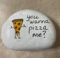 a rock with a pizza on it that says, you wanna't pizza me?