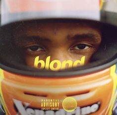 a close up of a person wearing a helmet with the word blond on it's face