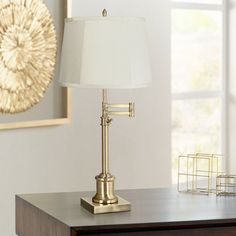 a desk lamp on top of a wooden table