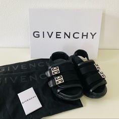 100% Authentic, New With Box And 2 Dust Bags. Size 36 Us 6 Sandals In Suede And Smooth Calfskin Leather. Color: Black. Wide Strap With Hook-And-Loop Fastened Closure Featuring Two 4g Metal Buckle Straps On The Front. Canvas Strap With Givenchy Leather Reinforcement On The Back. Light And Comfortable Thick Sole. Givenchy Signature In Relief On The Back. 4g Emblem Engraved On The Side. Black Sandals With Logo Strap For Summer, Designer Black Sandals With Logo Strap, Luxury Slingback Strap Sandals, Luxury Black Sandals With Adjustable Strap, Luxury Leather Sandals With Adjustable Strap, Designer Black Sandals With Adjustable Strap, Black Designer Sandals With Adjustable Strap, Luxury Black Sandals, Luxury Slingback Sandals With Adjustable Strap