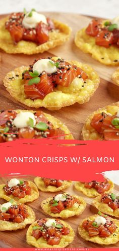 small crackers topped with tomatoes and cheese on a wooden board next to the words wonton crisps w / salmon