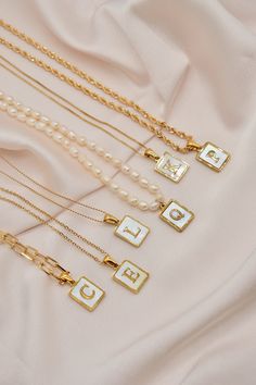 Details: - 18K Gold Filled Paperclip chain. Link size: Approx. 10mm x 4mm - 18K Gold Plated Rolo chain - 14K Gold Filled Beaded Chain - 18K Gold Filled Box Chain - 18K Gold Filled Rope chain. Thickness: 4mm - Natural Freshwater Pearl  - Pendant size: 12mm x 15mm - Pendant material: Shell. 18K gold plated.  *This listing is only for ONE necklace only* Each item is individually placed on our MIKUKUMI leather card & cotton pouch.  *IMPORTANT NOTE* How to measure your perfect necklace?  1. Take a pi Letter Necklace Gold, Gold Initial Necklace, Gold Link Necklace, Paperclip Chain Necklace, Preppy Jewelry, Cotton Pouch, Necklace Layering, Initial Necklace Gold, Charm Necklaces