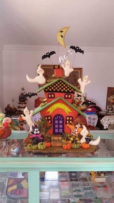 a display case filled with lots of halloween decorations and figurines on top of it