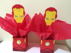 two paper bags with iron man faces on them