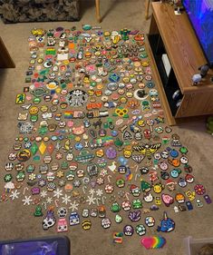 a carpet covered in lots of different types of buttons