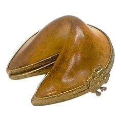 two gold colored hats sitting on top of each other