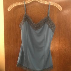 Top Has Built In Self Bra. 100% Polyester. Never Worn And Has Tag. Blue V-neck Camisole For Loungewear, Blue Cami Tank Top For Loungewear, Chic Blue Camisole Top, Blue Fitted Tank Top For Loungewear, Casual Blue Camisole For Loungewear, Blue Stretch Camisole Top, Blue Stretch Camisole, Stretch Blue Camisole For Loungewear, Blue Stretch Camisole For Loungewear