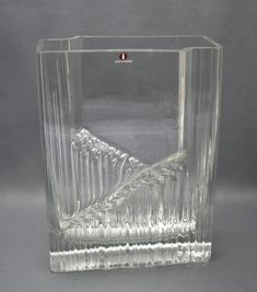 a clear glass vase sitting on top of a table