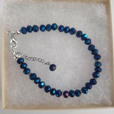 Blue Color Glass Crystal Faceted Bracelet ,Blue Beads, Blue Faceted Beads, Faceted Round Beads, Silver Spacers, Silver Clasp Approximately 7 inches, make sure this will fit your wrist. Beads used are  6 mm in diameter  All my bracelets are handmade by me. Please note -  I do my very best to give you accurate measurements and descriptions All my jewelry is delivered in a gift box and beautiful organza gift bag, perfect for keeping your jewelry safe, or ready to give if it is a gift! Colors could vary due to lighting * see more brackets at https://decowrist.etsy.com/ No refunds or exchanges Blue Crystal Bracelet With Spacer Beads, Adjustable Faceted Blue Crystal Bracelet, Blue Faceted Beaded Bracelets, Blue Oval Beaded Bracelets With Faceted Beads, Blue Beaded Bracelets With Faceted Oval Beads, Blue Beaded Crystal Bracelet With Round Beads, Blue Crystal Bracelet With Polished Round Beads, Blue Crystal Bracelet With Polished Beads For Gift, Blue Crystal Bracelet With Polished Beads As Gift