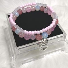 Blush Boutique Beads Bracelet Sets with Glass Beads,  and Gemstone Crystal  Beads,  Glass Seed's Beads, and Silver Charms. Each Charm is Random for Each Bracelet. Pink Bohemian Beaded Crystal Bracelet, Pink Gemstone Beads Charm Bracelet, Adjustable Pink Gemstone Beaded Bracelets, Pink Gemstone Beads Stretch Bracelet For Jewelry Making, Adjustable Rose Quartz Beaded Bracelet With Round Beads, Pink Beaded Charm Bracelet, Rose Quartz Faceted Beaded Bracelets, Handmade Rose Quartz Beaded Bracelets, Rose Quartz Beaded Bracelets With Faceted Beads